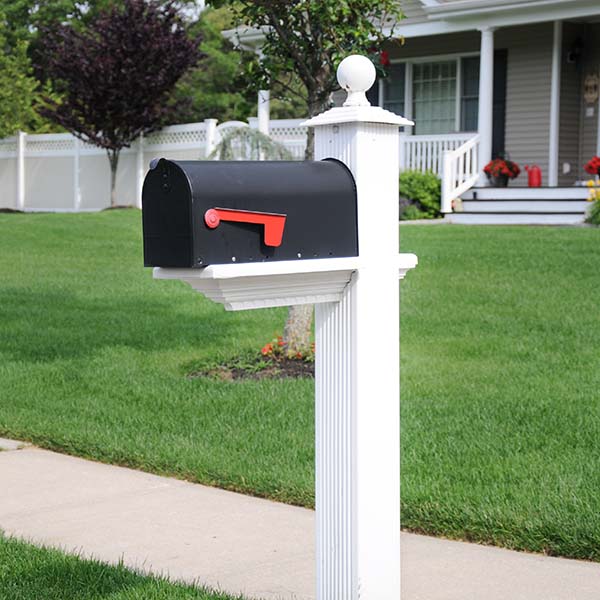 Black mailbox along sidewalk in surburban residential area